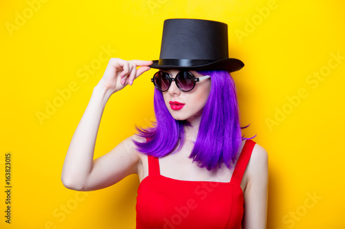 Portrait of young girl with purple color hair and Top hat