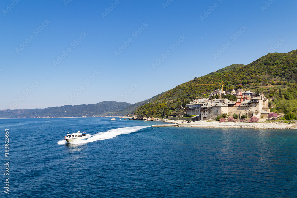 The boat departs from the Xenophontos Orthodox monastery on the Mediterranean cost, Mount Athos, Greece