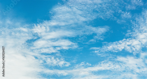Blue sky with white flurry cloud. for background.