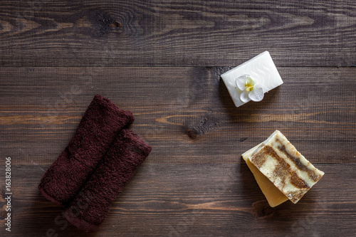 Relax concept. Handmade organic soap on wooden table background top view copyspace