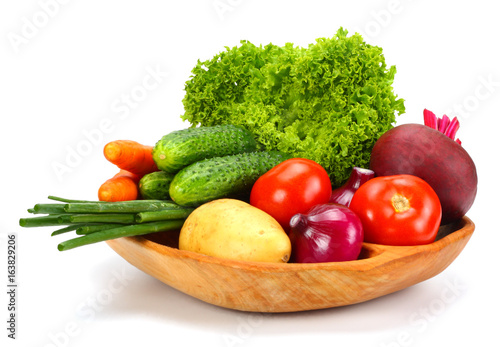 Assortment of fresh raw vegetables isolated on white background. Tomato, cucumber, onion, salad, carrot, beetroot, potato