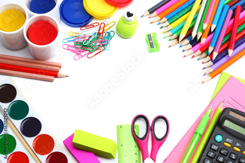 school and office supplies. school background. colored pencils, pen, pains, paper for  school and student education isolated on white background. top view