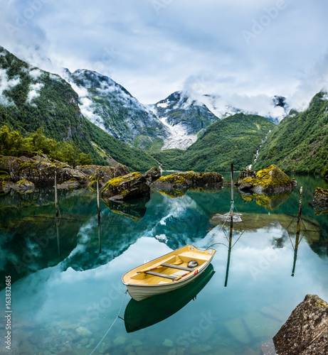 Fishing boat on mountain lake Norway