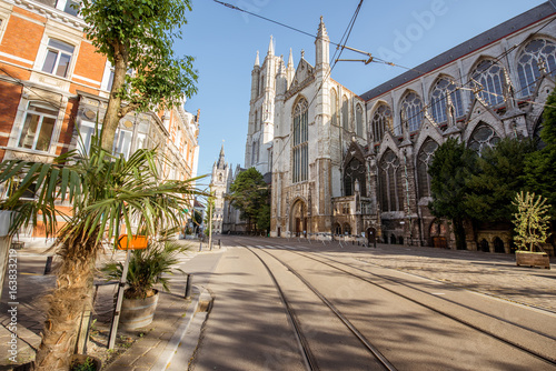 Street view with saint Bavo cathedral during the morning light in Gent city, Belgium photo