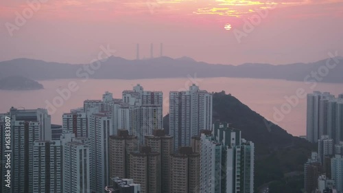 Hong Kong Aerial v157 Closeup view flying low around condominium buildings at sunset photo