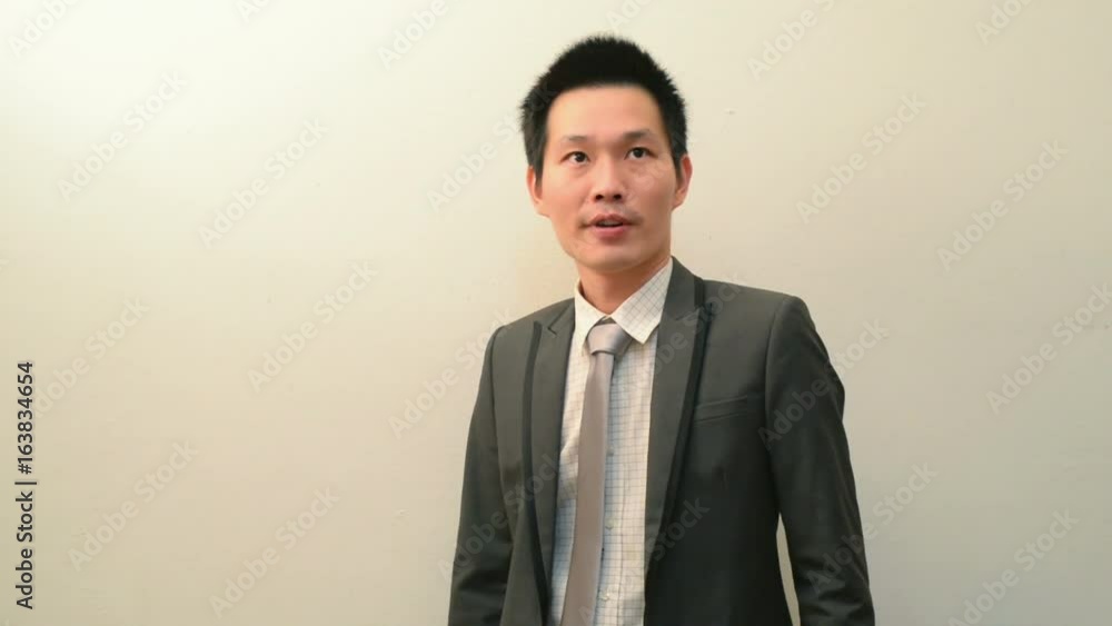 Asian businessman waiting for colleague Asian businessman waiting for colleague