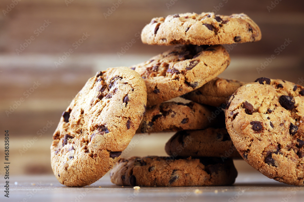 Chocolate cookies on wooden table. Chocolate chip cookies shot Chocolate cookies on wooden table. Chocolate chip cookies shot