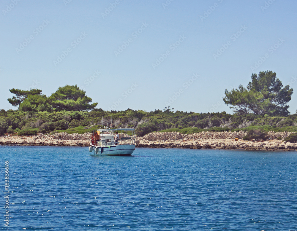 Holiday cruise around Croatian islands on blue sea waters Holiday cruise around Croatian islands on blue sea waters