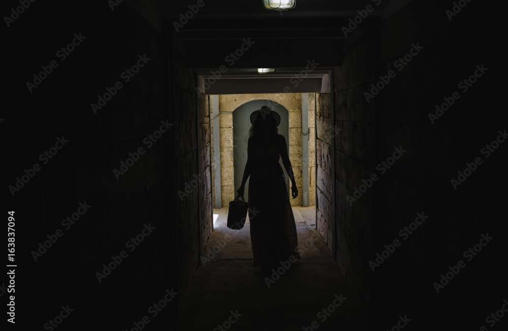 Woman walking along the corridor
