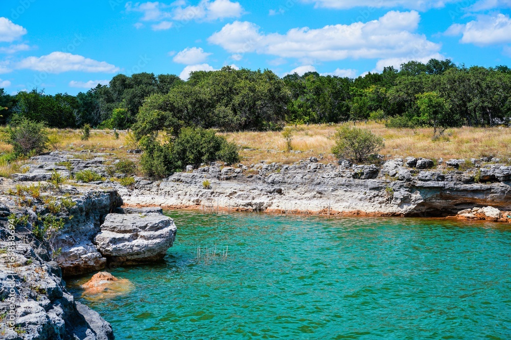 The rocky cliffs along the shoreline of Lake Travis make it a little The rocky cliffs along the shoreline of Lake Travis make it a little