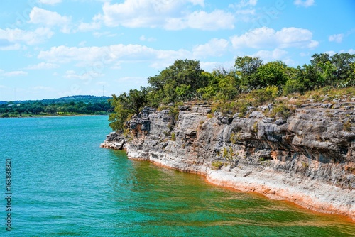 Lake Travis in Texas has some incredible cliffs on the edge of the lake to climb or jump into the water from.