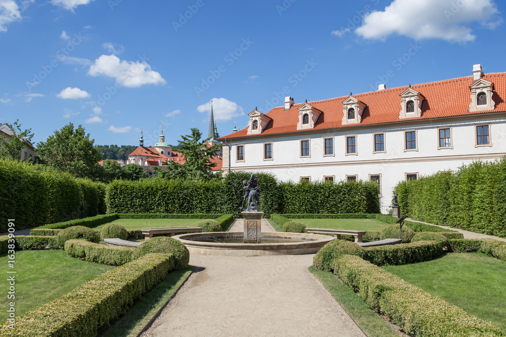 Statue and building at the formal Wallenstein (Waldstein) Garden (Valdstejnska Zahrada)). It is a public Baroque garden at the Lesser Town (Mala Strana) in Prague, Czech Republic. 