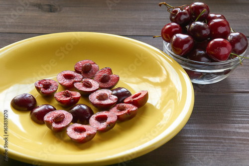 beautiful pattern from sweet cherry on a yellow plate