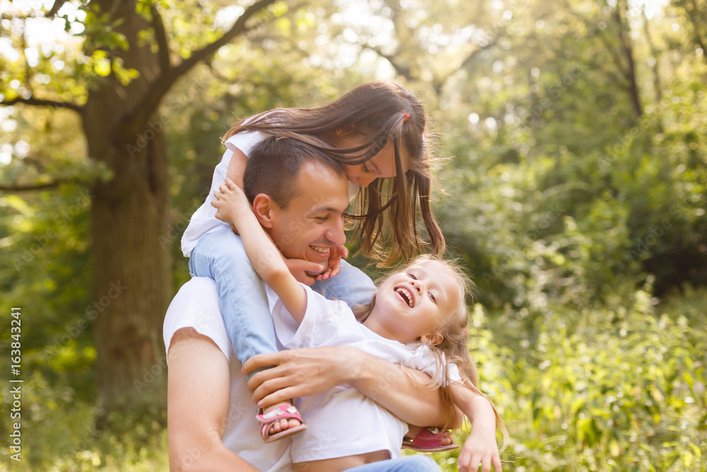 Happy father with daughter on his shoulders Happy father with daughter on his shoulders