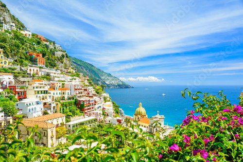 Fototapeta Naklejka Na Ścianę i Meble -  beautiful view on Positano on Amalfi coast with blurred flowers on foreground