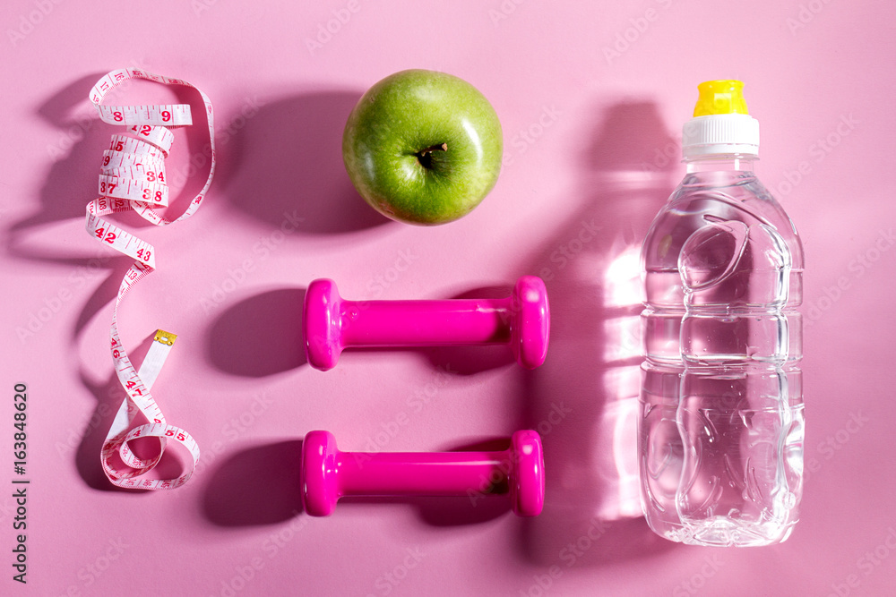 Flat Lay Sport Concept Healthy Life Equipment on Bright Pink Background. Closeup with Copy Space. Flat Lay Sport Concept Healthy Life Equipment on Bright Pink Background. Closeup with Copy Space.