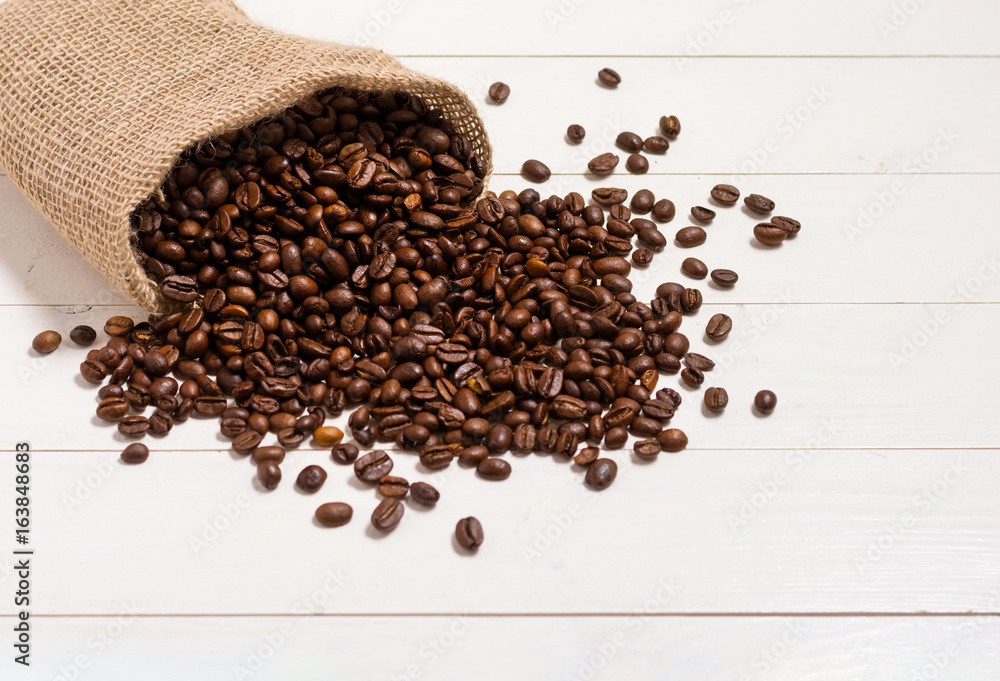 Sack of coffee beans on white table Sack of coffee beans on white table