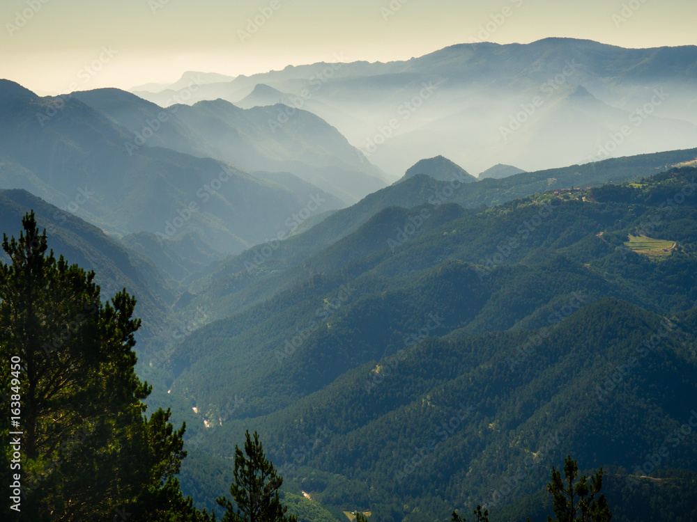 Obraz premium MIsty valley in Pyrenees