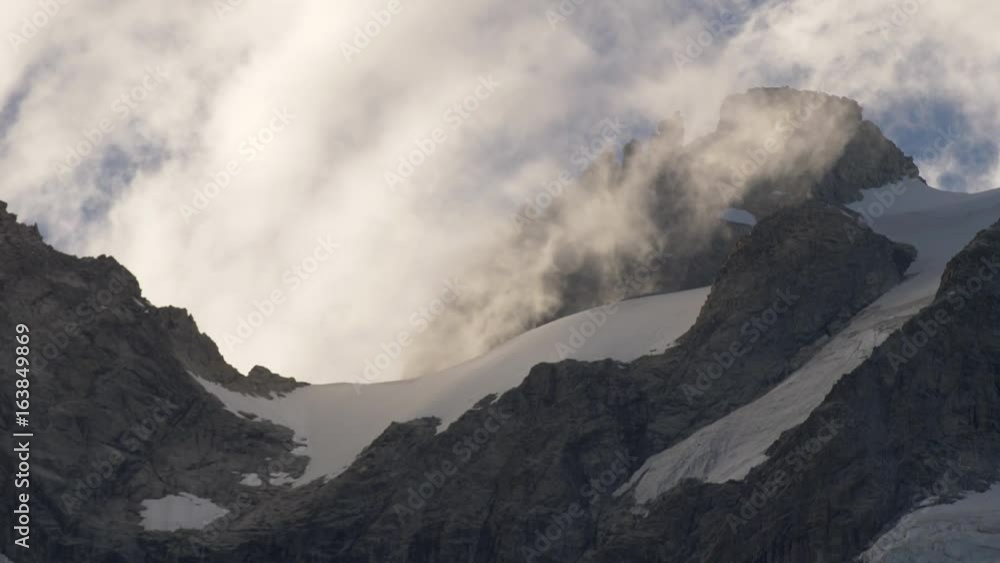 Fast Moving Clouds on the Mountain Range. Mont Blanc Massif Fast Moving Clouds on the Mountain Range. Mont Blanc Massif