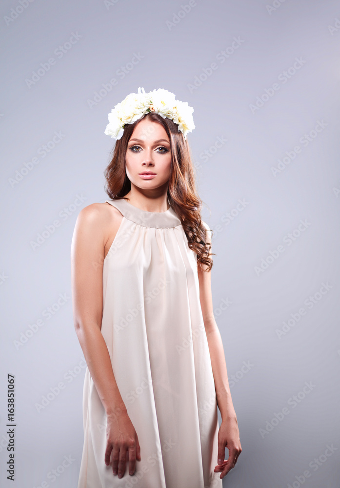 Portrait of a beautiful woman with flowers in her hair Portrait of a beautiful woman with flowers in her hair