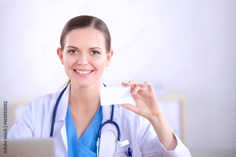 female doctor holding an empty card, isolated on white background female doctor holding an empty card, isolated on white background