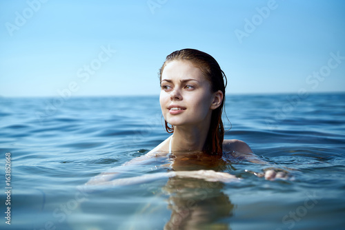 Beautiful young woman resting on the sea  ocean  beach  summer  sun