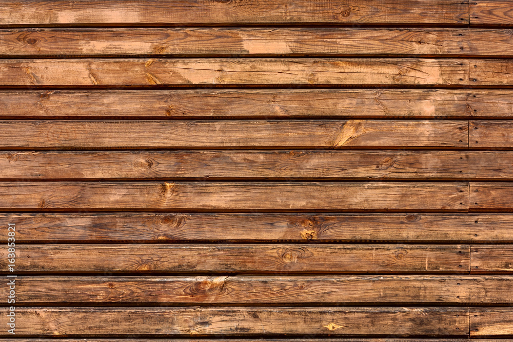 Brown background texture of horizontal wooden planks logs bark. Brown background texture of horizontal wooden planks logs bark.