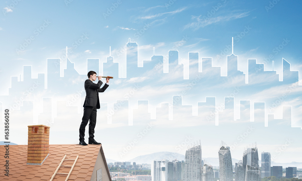 Engineer man standing on roof and looking in spyglass. Mixed media Engineer man standing on roof and looking in spyglass. Mixed media