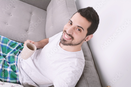 Man drinking coffee.