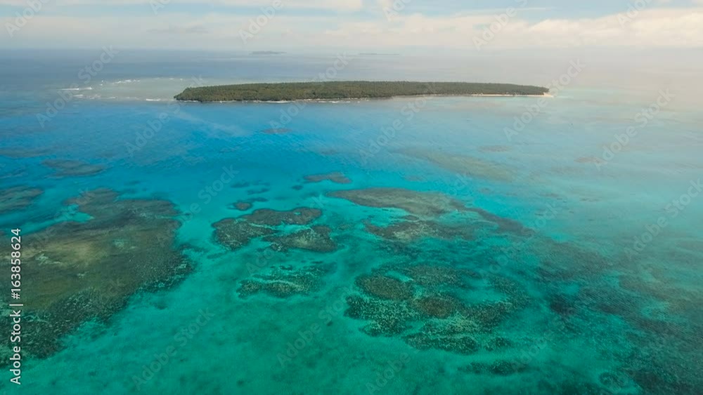 Flying over the blue sea in the azure lagoon. Aerial view: water surface. Tropical sea. Philippines. Flying over the azure surface of the ocean. 4K video. Travel concept. Aerial footage. Flying over the blue sea in the azure lagoon. Aerial view: water surface. Tropical sea. Philippines. Flying over the azure surface of the ocean. 4K video. Travel concept. Aerial footage.