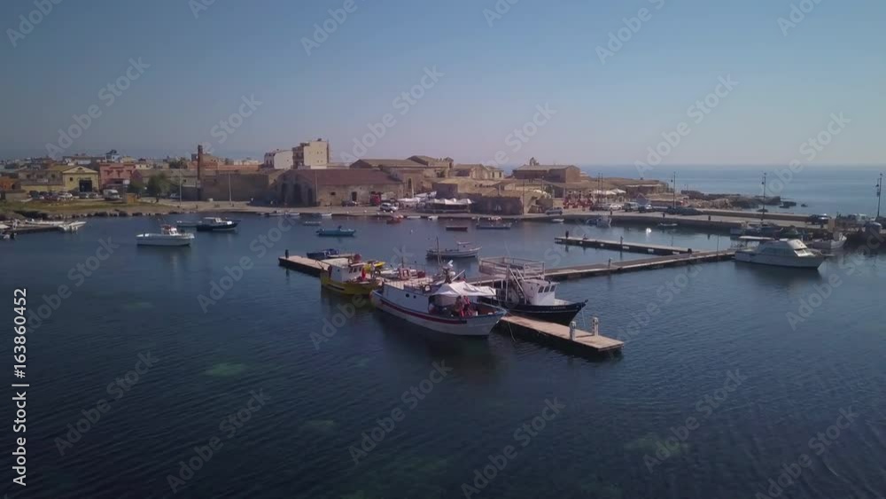 orbiting a pier in the marina in Marzamemi orbiting a pier in the marina in Marzamemi