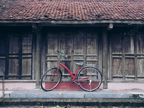 Old bicycle park with old house