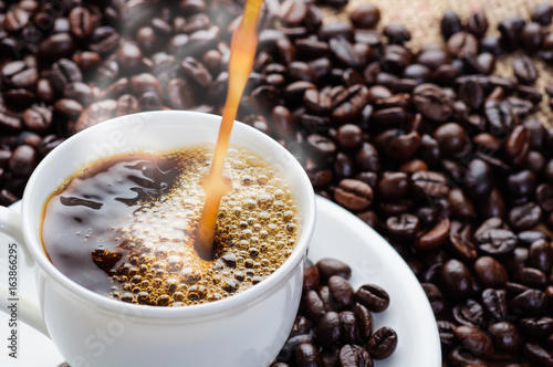 Coffee pouring shot  and coffee beans 