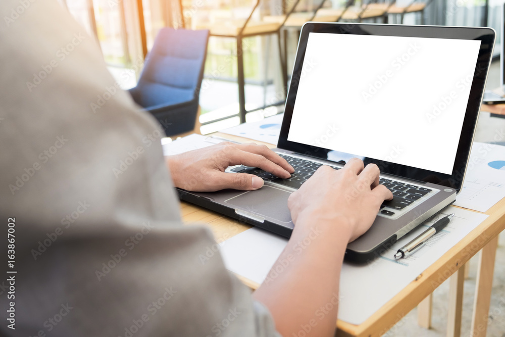 Business man working by using laptop computer. hand typing on laptop keyboard in his office Business man working by using laptop computer. hand typing on laptop keyboard in his office