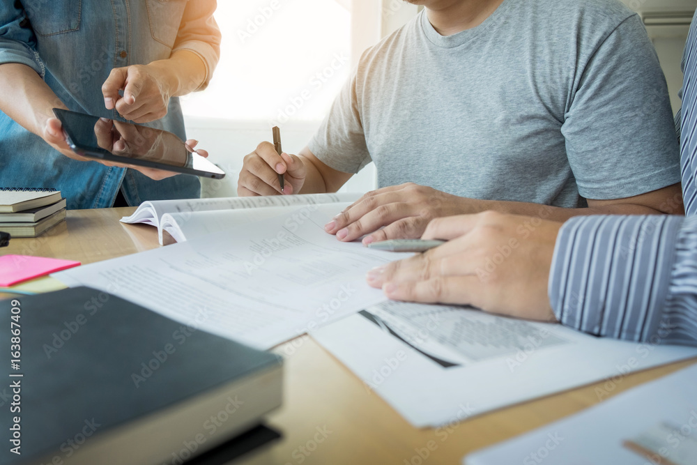 education, learning, teaching, technology and people concept -Female Home Tutor Helping friend With Using Digital Tablet education, learning, teaching, technology and people concept -Female Home Tutor Helping friend With Using Digital Tablet