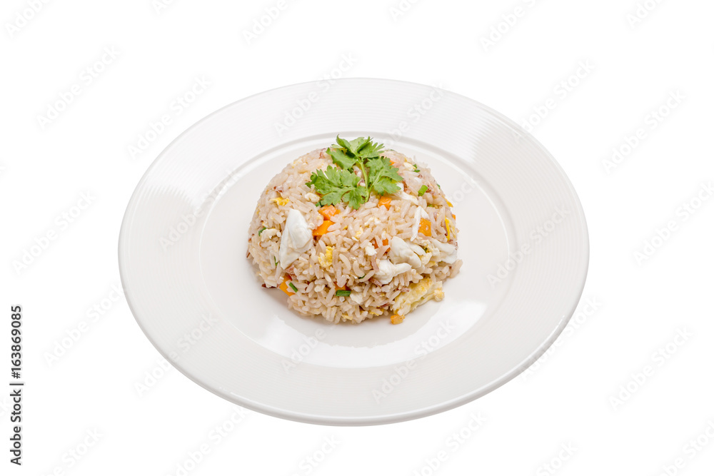 Tasty Thai cuisine, crab meat fried rice beautiful serving in white plate isolated on white background. Tasty Thai cuisine, crab meat fried rice beautiful serving in white plate isolated on white background.