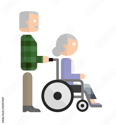 車椅子を押すシニア男性