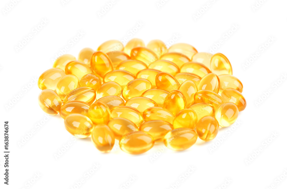 Fototapeta premium Fish oil pills. Cod liver oil omega 3 gel capsules isolated on white background.