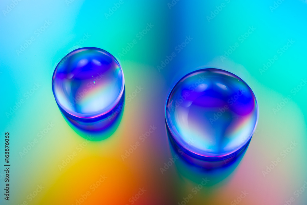 water drops on colorful background water drops on colorful background