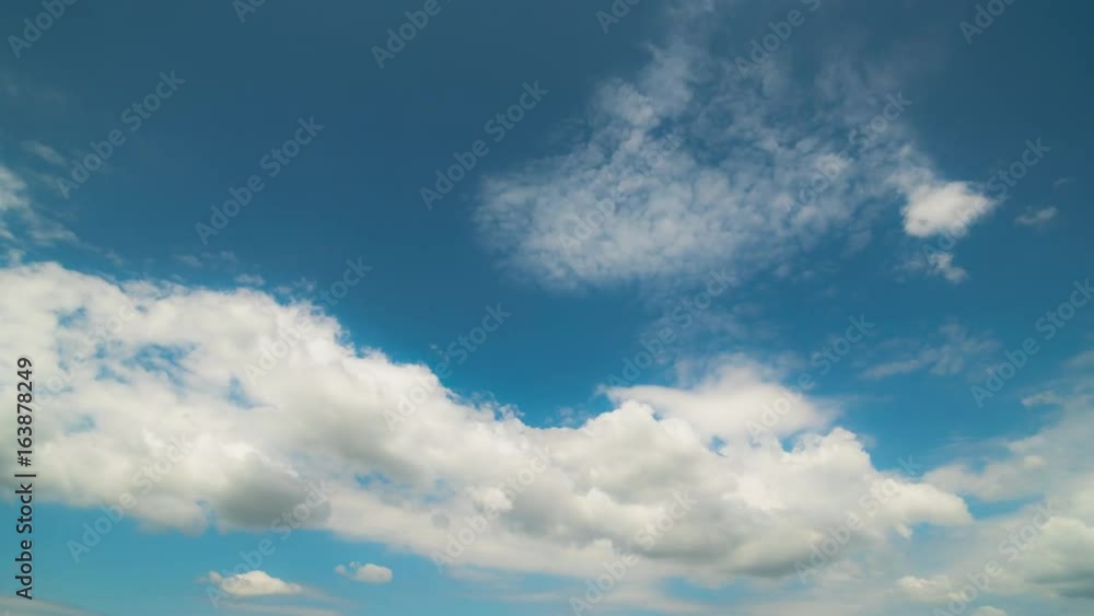 Intensive movement of white and gray clouds over the blue sky. In high resolution and high quality. Time laps does not have birds and foreign objects. Easy color correction prores 4444 Intensive movement of white and gray clouds over the blue sky. In high resolution and high quality. Time laps does not have birds and foreign objects. Easy color correction prores 4444