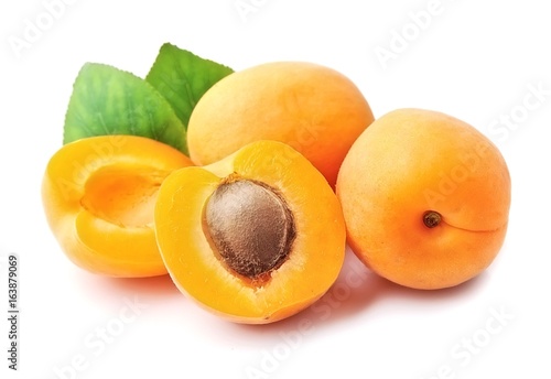 Sweet apricots with leafs .
