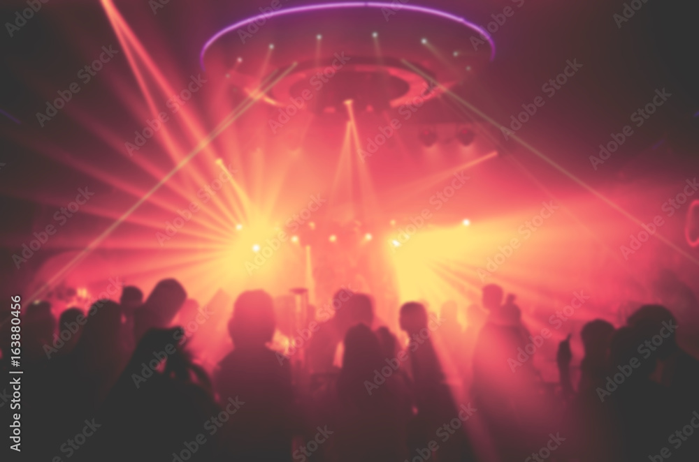 blur Light in club party Show And Silhouette of audience crowd people  enjoying the club party with concert. Blurry night club DJ party people enjoy of music dancing sound