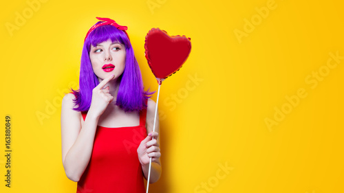 girl with purple hair with heart shape balloon