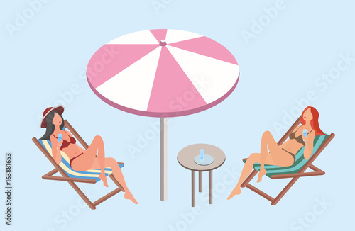 Two young women lying in the sun loungers with beach umbrella and relax Fototapeta