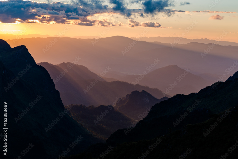 Sunset scene with silhouette mountain at Doi Luang Chiang Dao, Chiang Mai Province, Thailand Sunset scene with silhouette mountain at Doi Luang Chiang Dao, Chiang Mai Province, Thailand