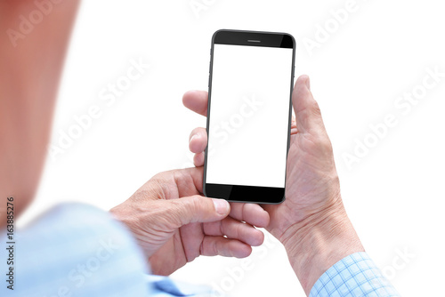 Old man holding smartphone with empty screen in hands