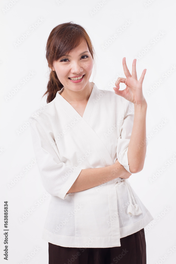 spa therapist giving ok hand gesture spa therapist giving ok hand gesture