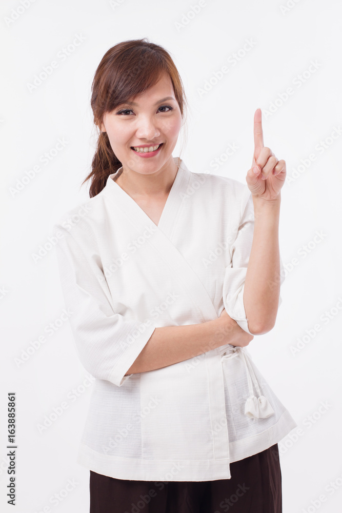 woman spa therapist pointing up 1 finger, counting, numbering woman spa therapist pointing up 1 finger, counting, numbering