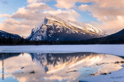 Winter Sunset over Frozen Vermilion Lakes with Mount Rundle in Background. Banff, Alberta, Canada.