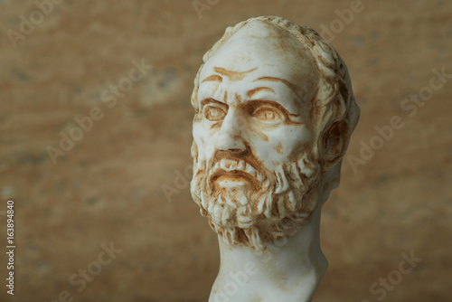 Statue of Demokritus,ancient greek philosopher. photo